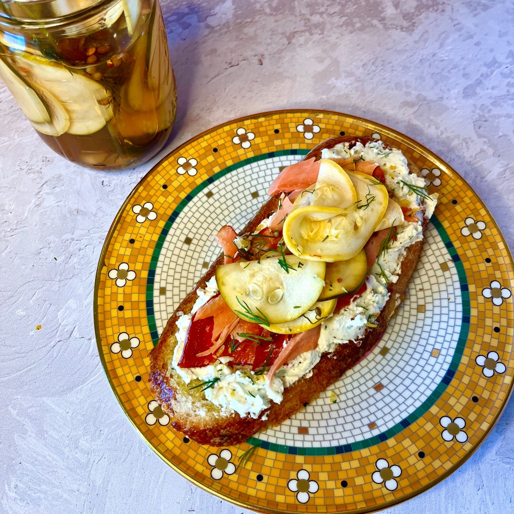 Salmon goat cheese toast w/ pickled summer squash